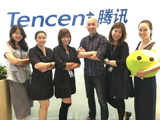 The team at the Tencent logo wall